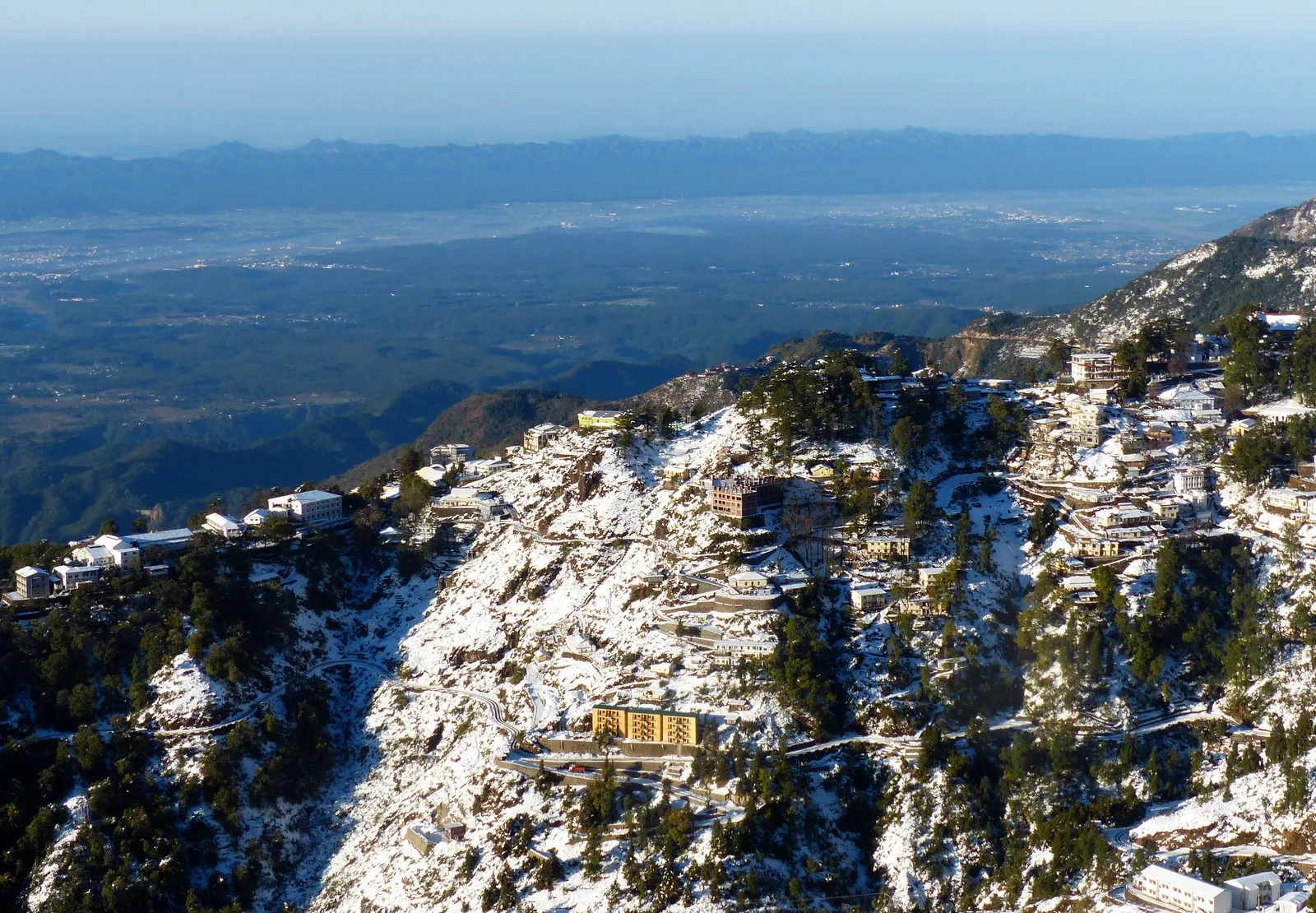 Snow-covered Mussoorie ridge overlooking the Dehradun valley